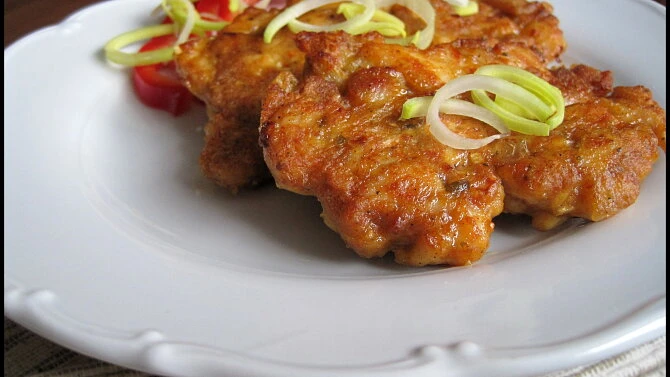 Fried chicken cutlets with garnish