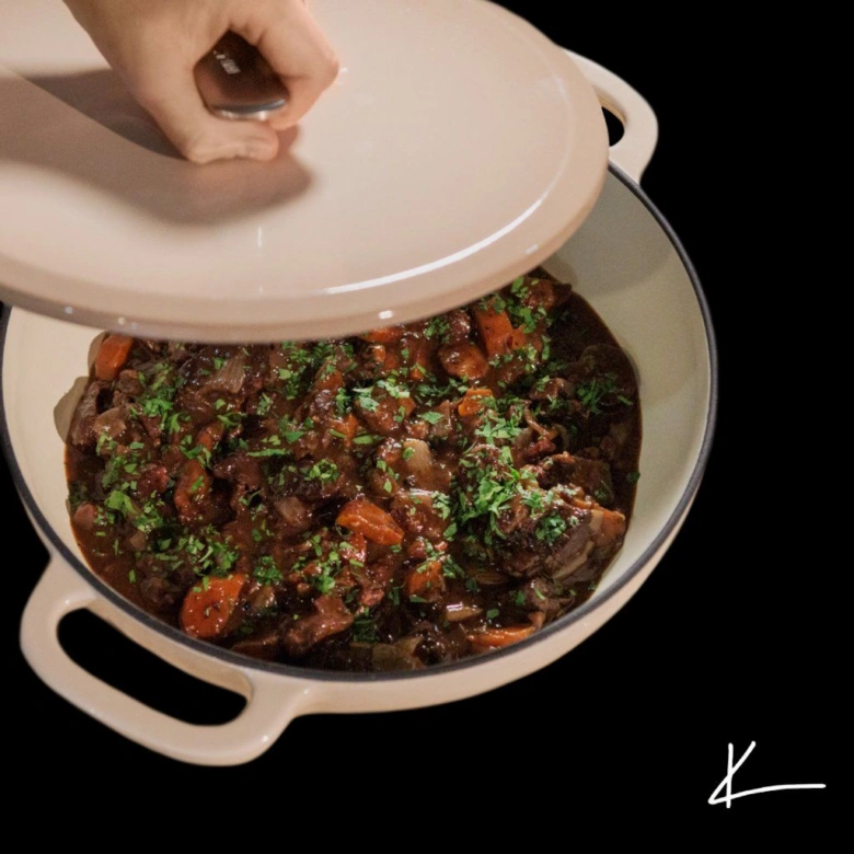 Beef stew with carrots and herbs