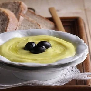 Garlic cream dip with olives and bread