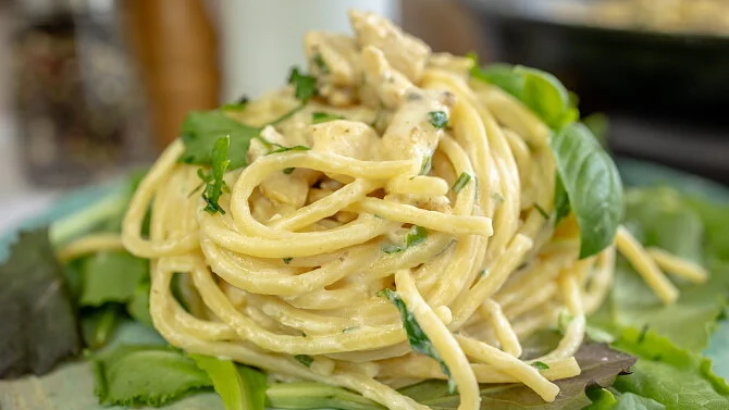 Creamy pasta dish with chicken and basil