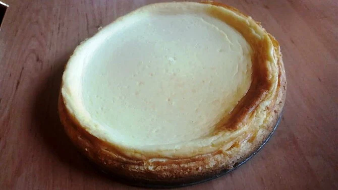 Baked cheesecake on wood table