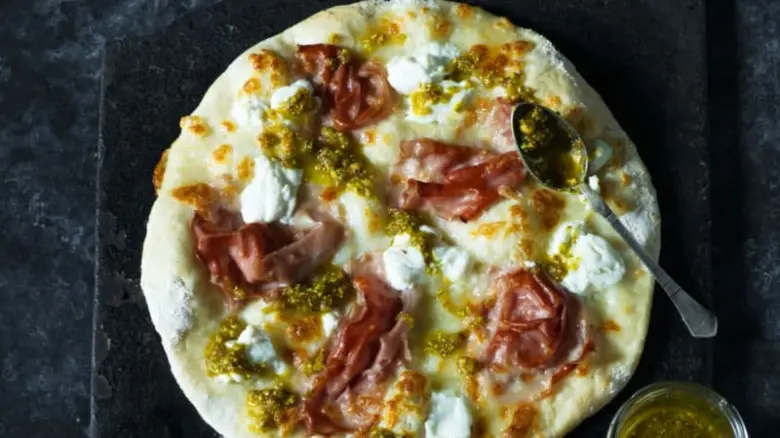 Pizza on baking sheet