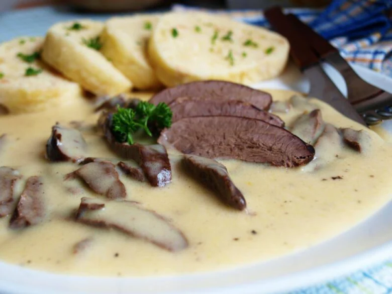 Creamy heart with mushrooms and dumplings