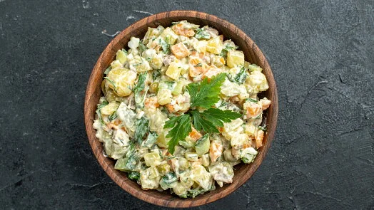 Potato salad in wooden bowl