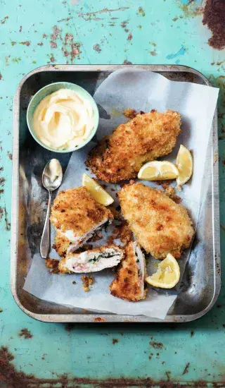 Breaded chicken cordon bleu with lemon and sauce