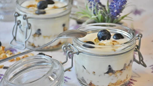 Yogurt dessert with berries and granola