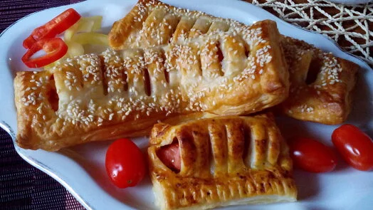 Sausage pastries with tomatoes