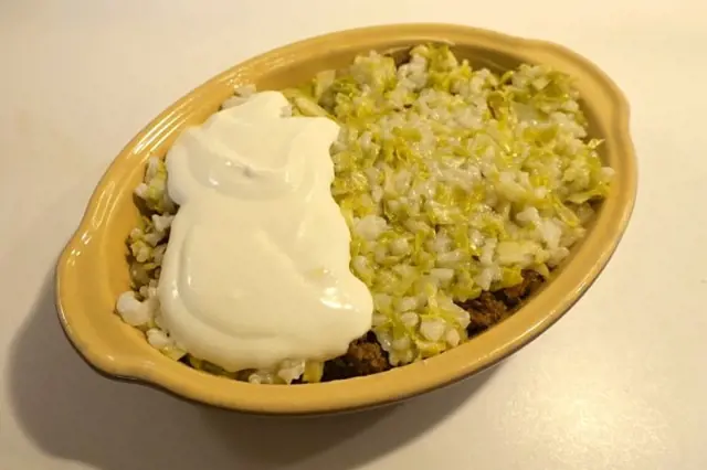 Cabbage with meat and sour cream