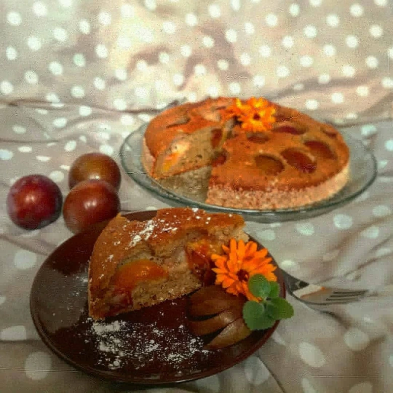 Plum cake with slice served