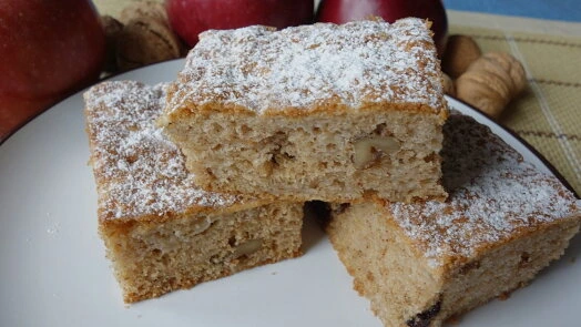 Apple cake slices with powdered sugar