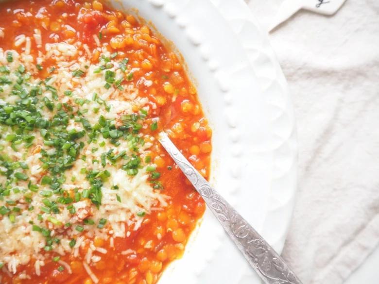Red lentil soup with garnish