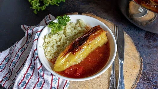 Stuffed peppers with rice and sauce