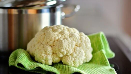 Cauliflower on green cloth